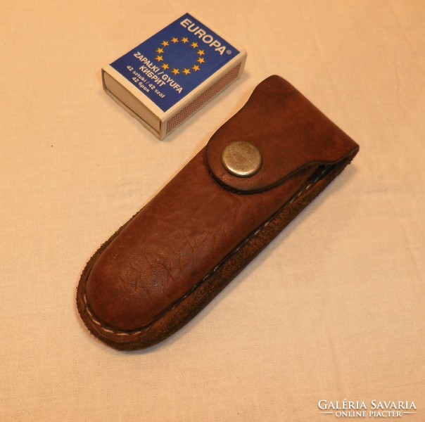 Old leather wallets, belt pouches.