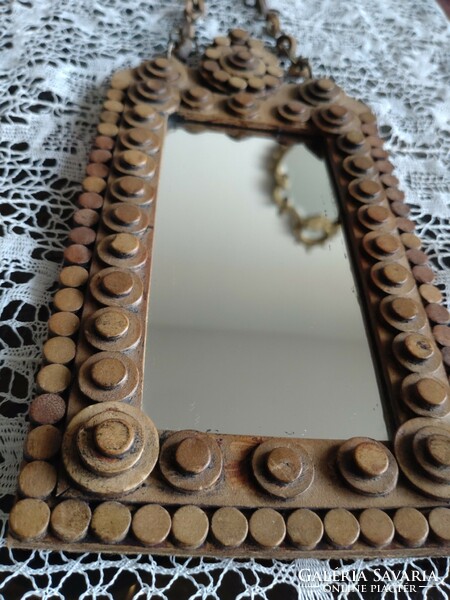 Decorative mirror with leather decoration