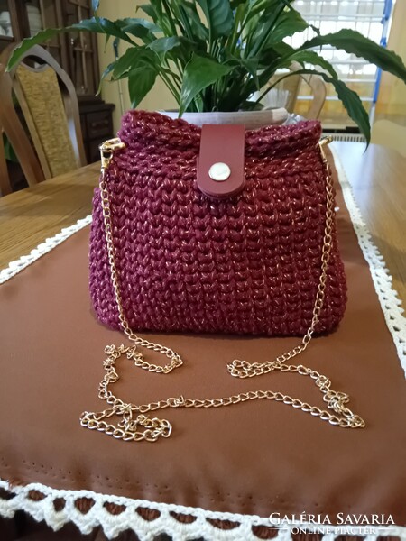 Casual bag crocheted from cord yarn interwoven with gold thread