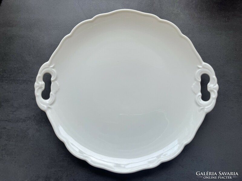 Old white porcelain serving bowl with handles, centerpiece, tray