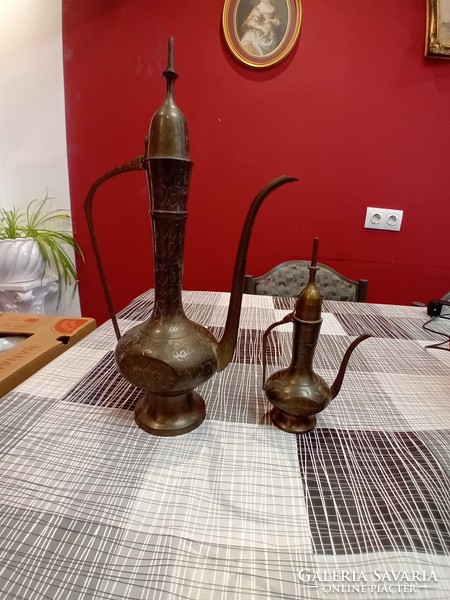 A pair of Indian copper decanters
