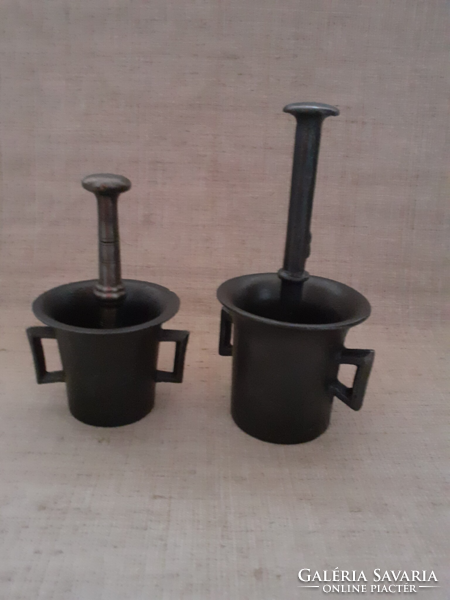 Antique small-sized cast iron mortar with pestle No. 1 and No. 2. In one
