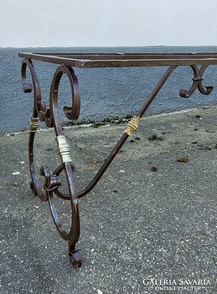Special, old forged garden table frame with copper elements