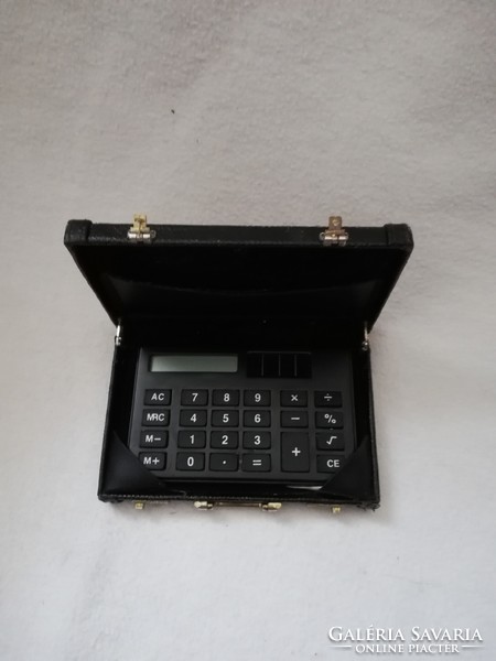 Vintage calculator in a suitcase