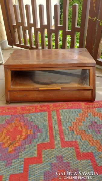 Old record player in a wooden display cabinet