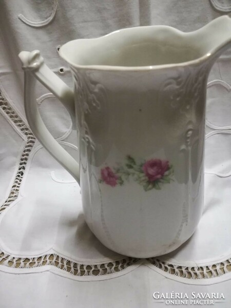Pink porcelain jug, spout, with damage on the spout