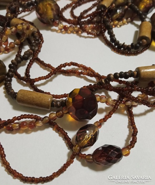 Fashion necklace - long brown with several rows of mixed pearls