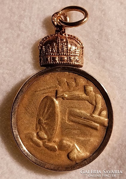 A really rare gold-framed crown coin pendant.