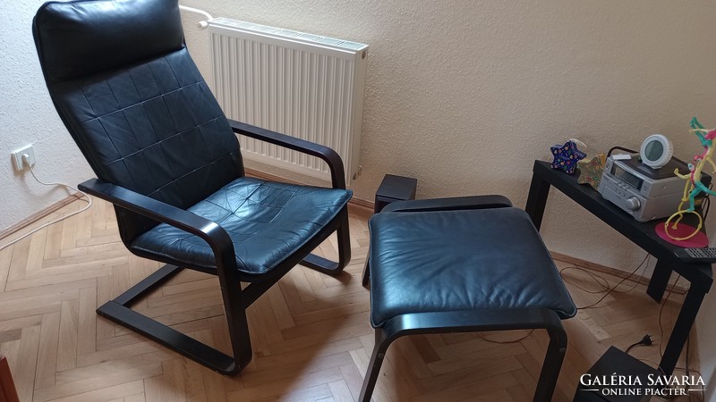 Black armchair with footrest