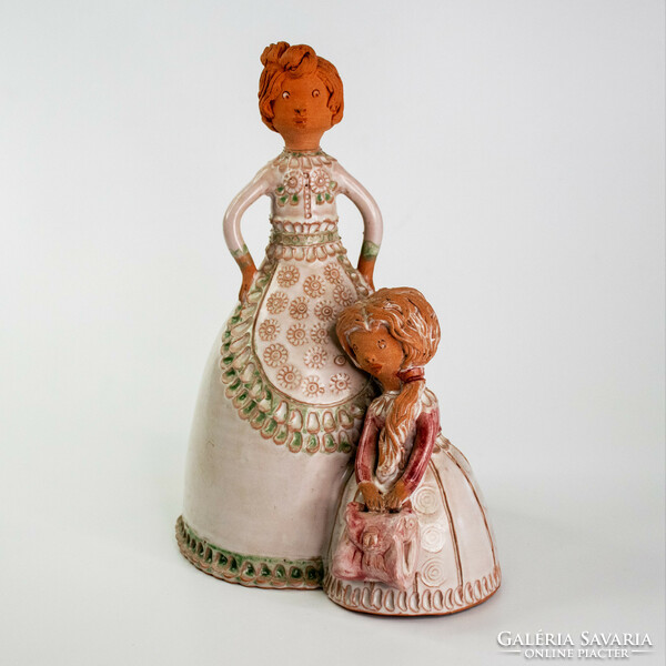 Ceramic statue of a mother with her daughter