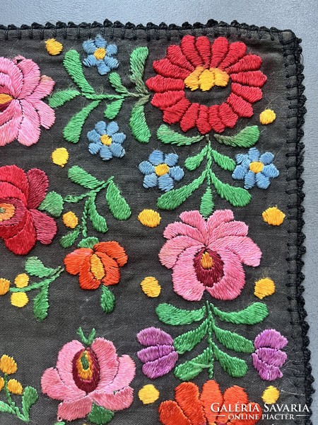 A wonderful, soft, richly embroidered placemat with silk