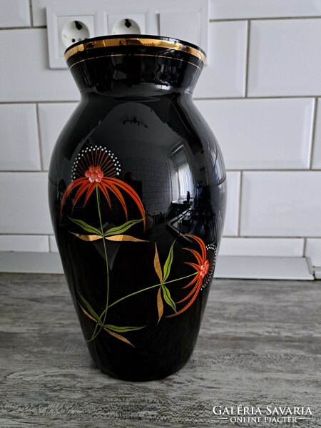 Black vase with floral pattern