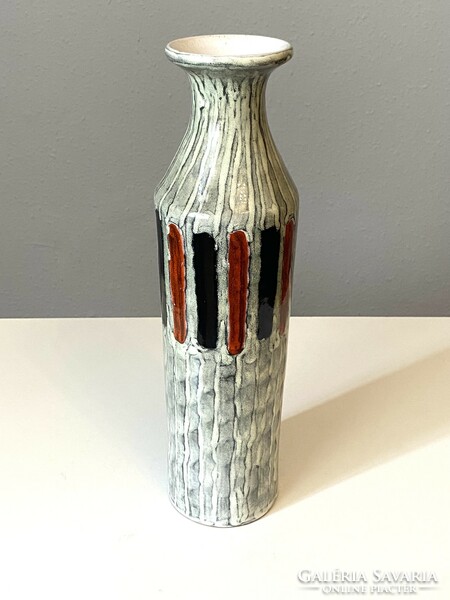 Illés retro ceramic vase on a white background with a striped pattern with a small lack of glaze at the bottom