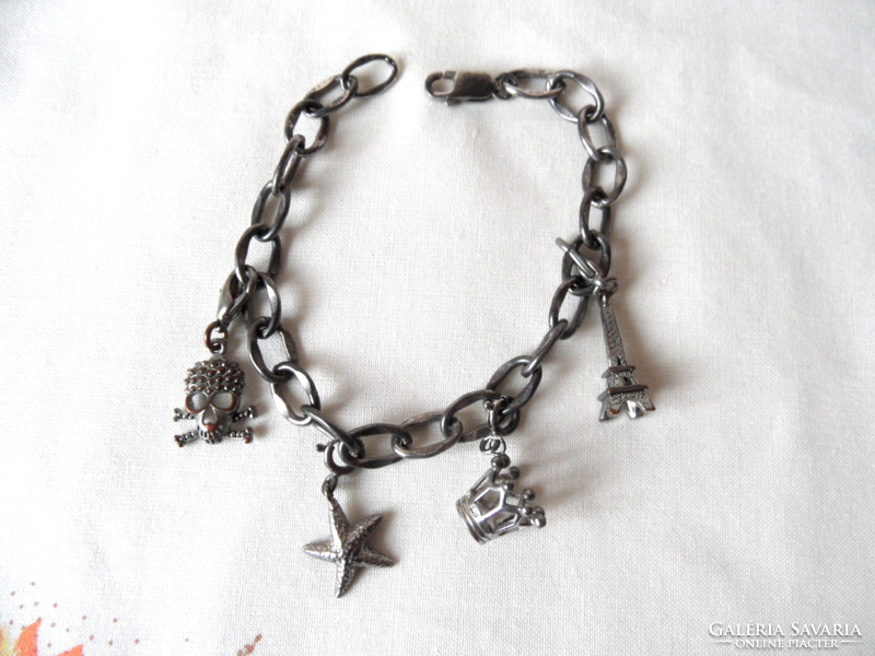 Metal bracelet with miniature figures