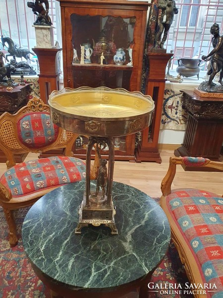Original Art Nouveau table with its original glass insert. A particularly beautiful piece. 52cm high.