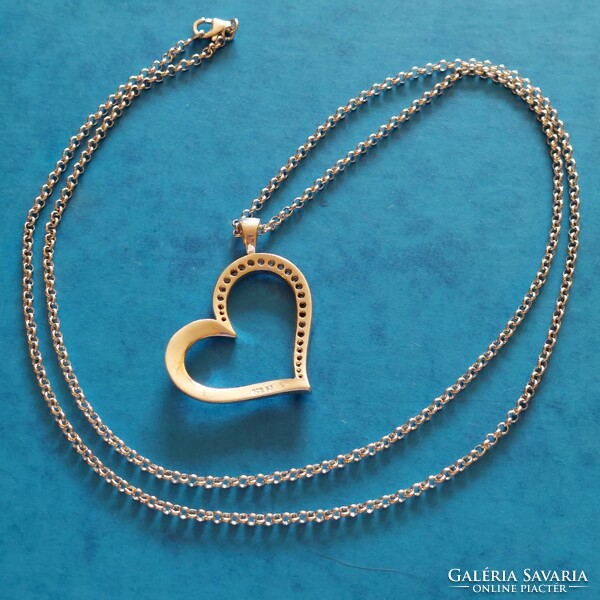 Beautiful silver heart pendant with zirconia stones on a long anchor style chain