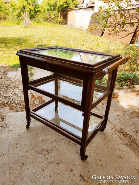 Antique art deco party cart with round glass, opening door, pull-out and removable tray from 1930