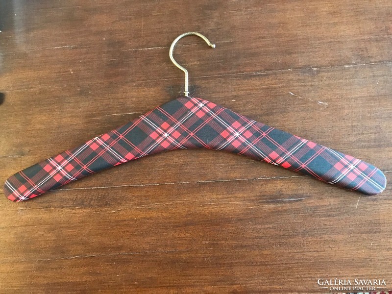 Retro clothes hanger. Shoulder wood. With red checkered leather.