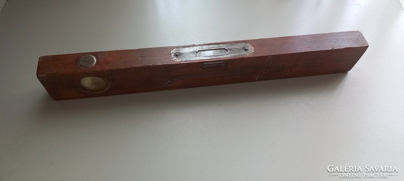 Peaceful working wooden spirit level with iron and glass parts