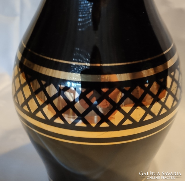 Black vase with gold decoration