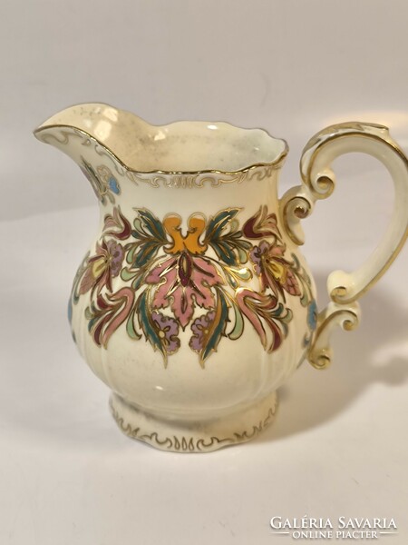 Zsolnay richly painted cream pourer with a rare pattern