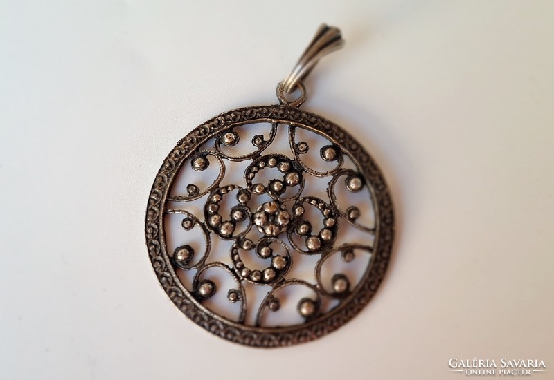 Silver colored vintage pendant