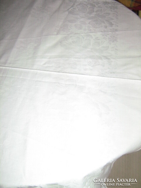 Beautiful rosy snow-white damask tablecloth