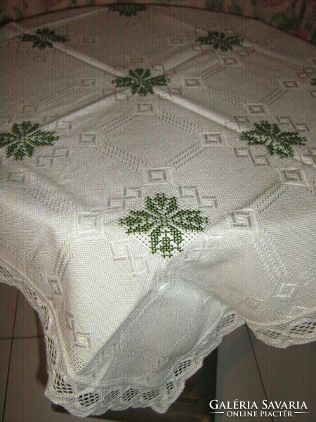 Beautiful elegant butter-colored hand-embroidered tablecloth with lacy edges