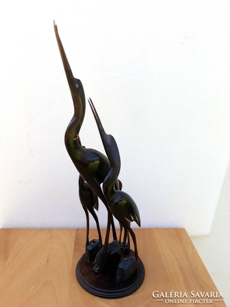 Carved heron family from horn
