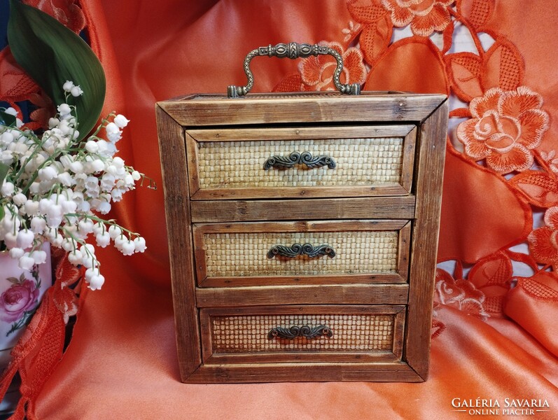Wooden chest of drawers with copper handles