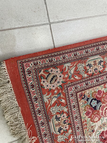 Ghom antique silk Persian rug with a bird motif