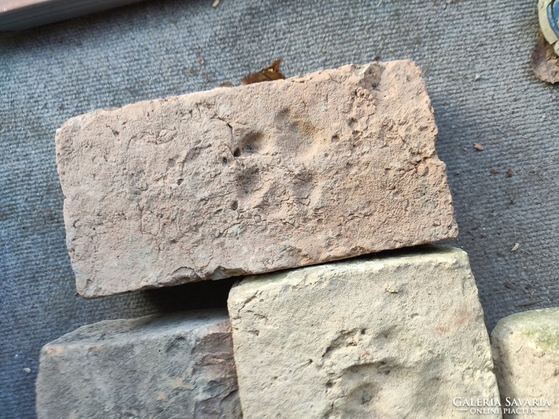 Old brick with footprints