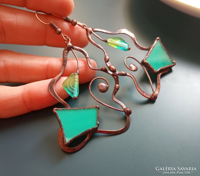 Handcrafted glass jewelry with a special visual appearance, with a turquoise pearl, a glass piece and a tendril