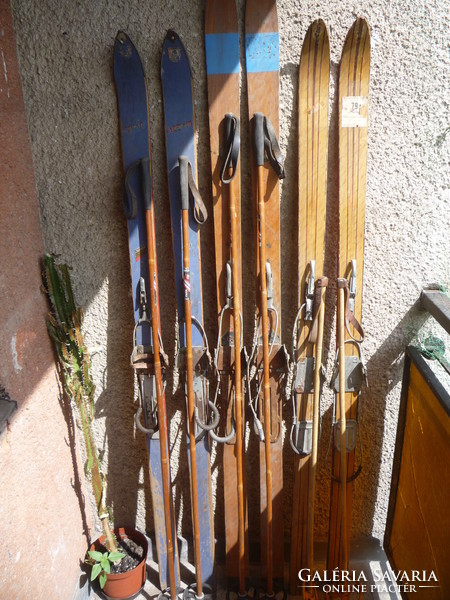Old wooden skis, poles.