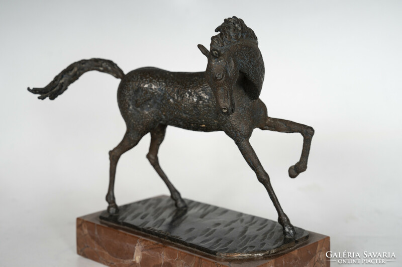 Abstract bronze horse figure on a marble plinth