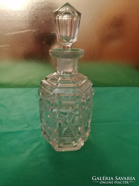 Old, fancy, polished cologne bottle with stopper