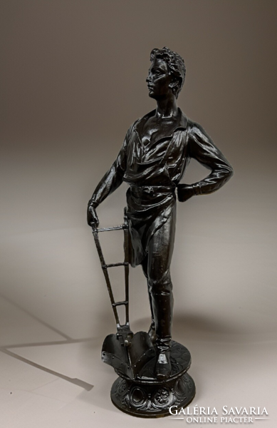 Statue of a farmer leaning on a plow