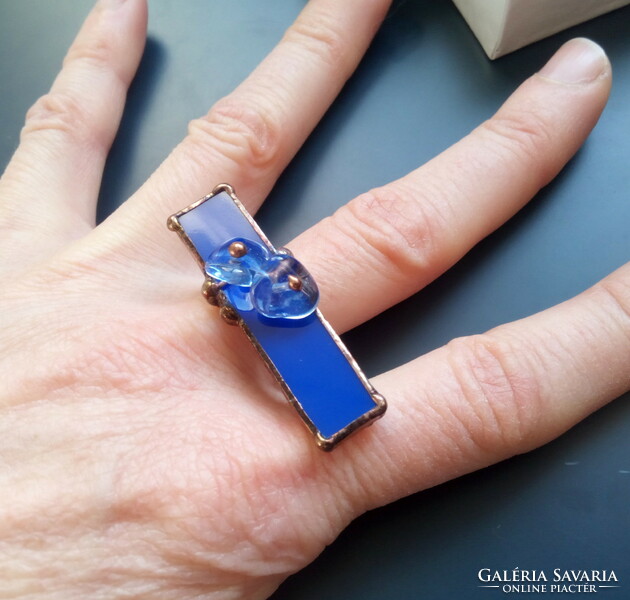 A special, large ring with royal blue glass and pearls