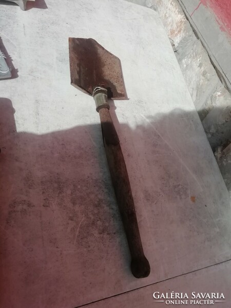 Old military spade in the condition shown in the pictures