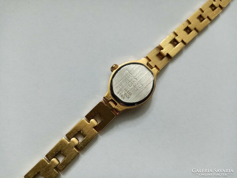 For sale, a vintage gold-colored seconds women's watch