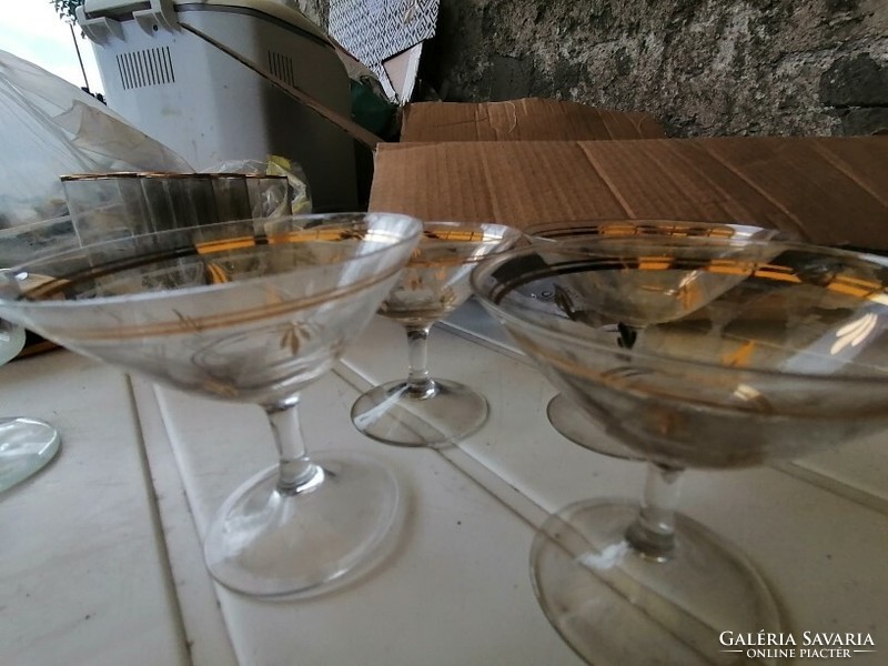 Vintage liqueur glasses with metal bases and a box with several options to choose from