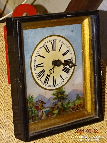 Peasant clock in Schwarzwald with black forest wall clock with alpine lake houses motif