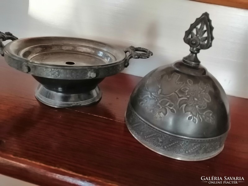 A silver-plated antique that keeps food warm
