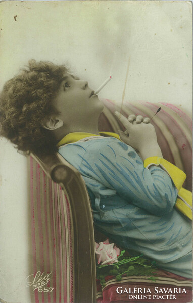 1925 - Young French woman with a cigarette. Romantic postcard. Colored photo sheet.