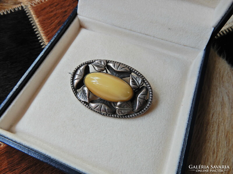 Old art nouveau style silver-plated brooch with vinyl-like stone inlay