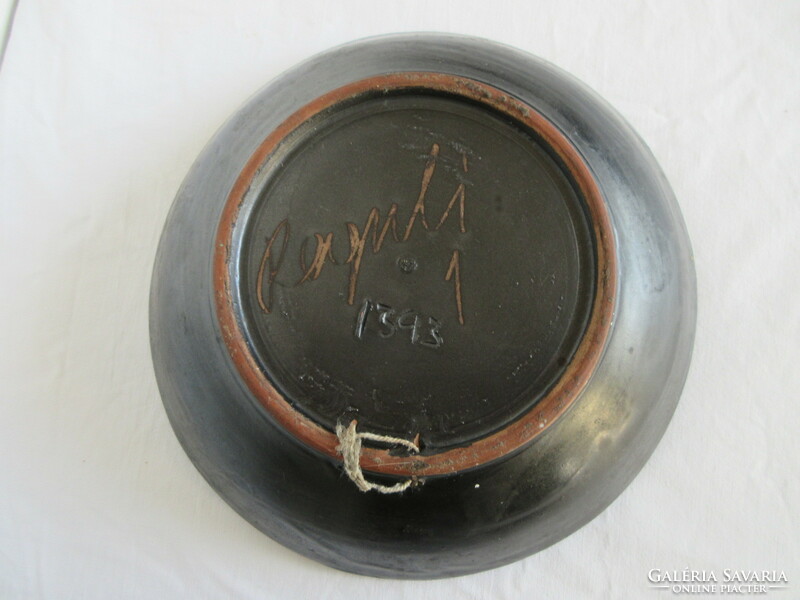 Old, marked, ceramic wall plate. Negotiable!