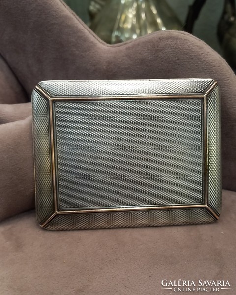Antique silver cigarette case with gold decoration