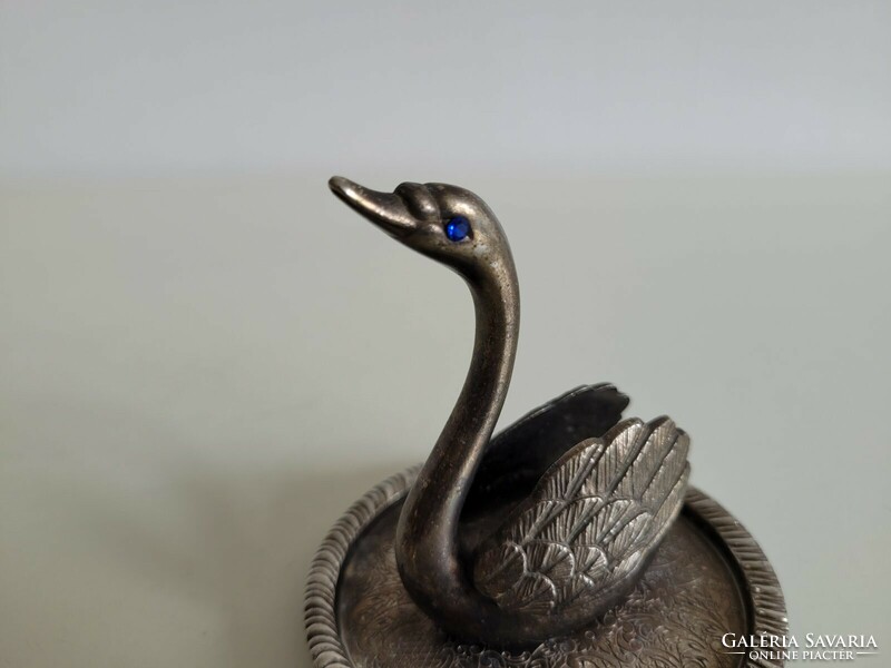 Old metal ornament in the shape of a swan