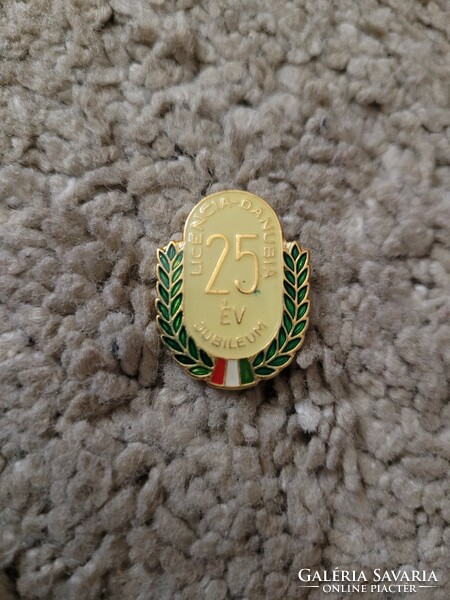 Enamel pin. License danubia 25 years.