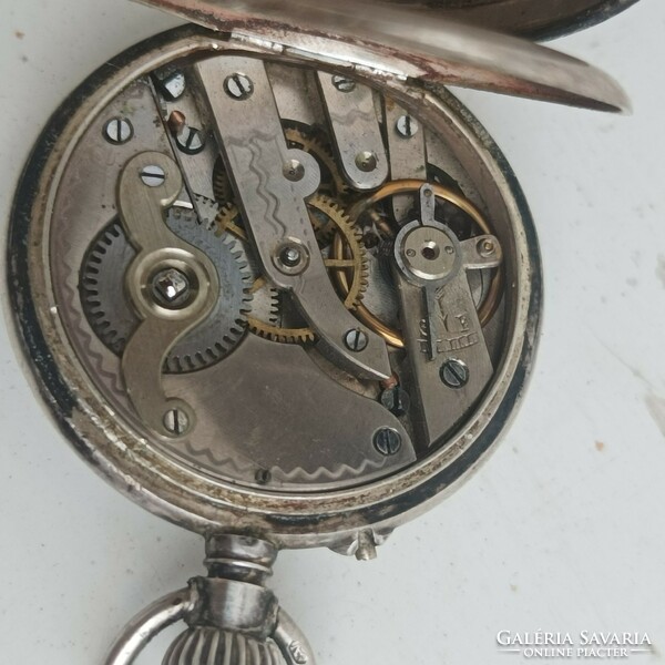 Silver pocket watch.